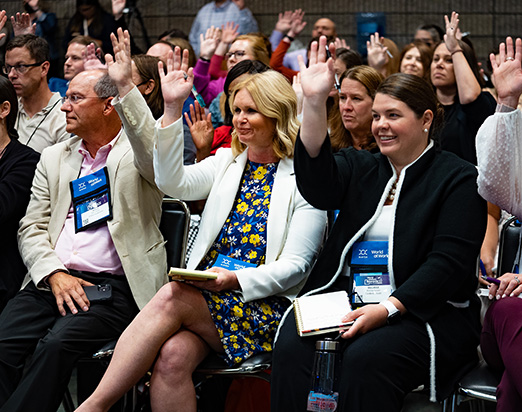 Attendees interact with each other and the presenter at a WorldatWork conference. 